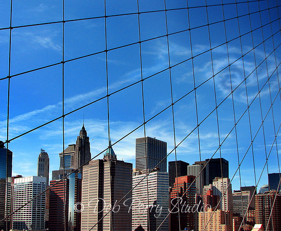Swirl of clouds thru the Brooklyn Bridge