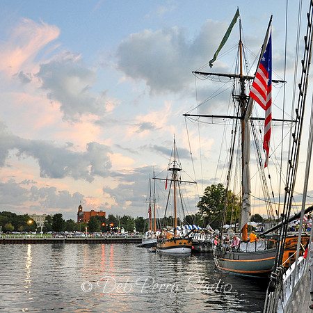 Tall ships are docked for the night in the marina