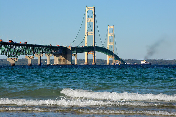 Ship passing under the Mackinac Bridge )