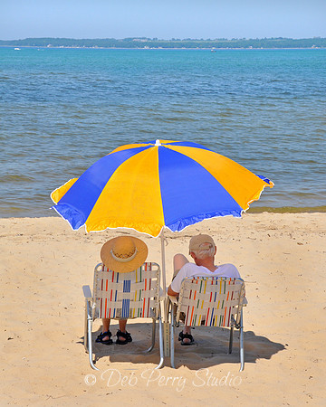 Couple relaxing on the beach at East Bay